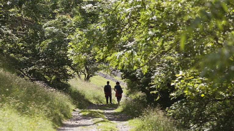 Walkers on path at Buckden, Upper Wharfedale, Yorkshire Dales